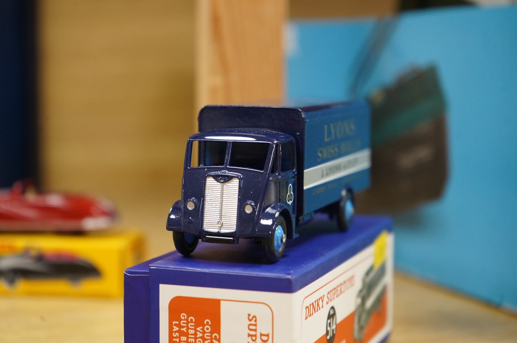 Twenty-two boxed Atlas Dinky Toys, including cars and commercial vehicles, Leyland tankers, a Foden wagon, sports cars, etc.